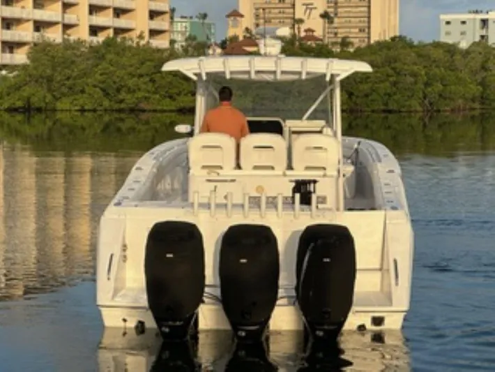  Yacht Photos Pics 2017 Stamas 390 Tarpon boat with triple outboard engines on calm water.