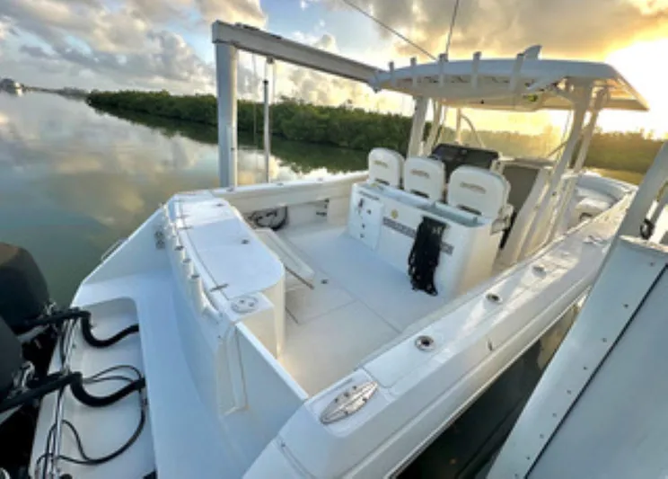  Yacht Photos Pics 2017 Stamas 390 Tarpon boat at sunrise, featuring spacious deck and seating.