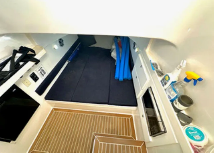  Yacht Photos Pics Interior cabin of 2017 Stamas 390 Tarpon boat with storage and cleaning supplies.