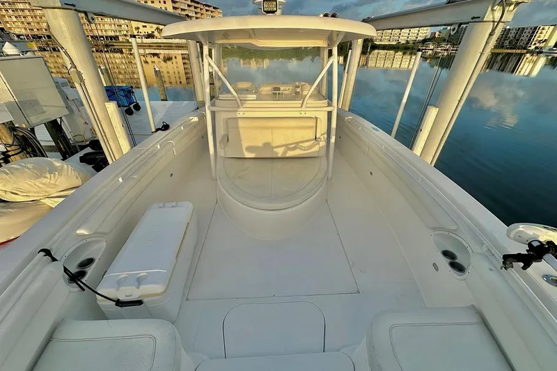  Yacht Photos Pics 2017 Stamas 390 Tarpon boat interior with seating and storage, docked by calm waters.