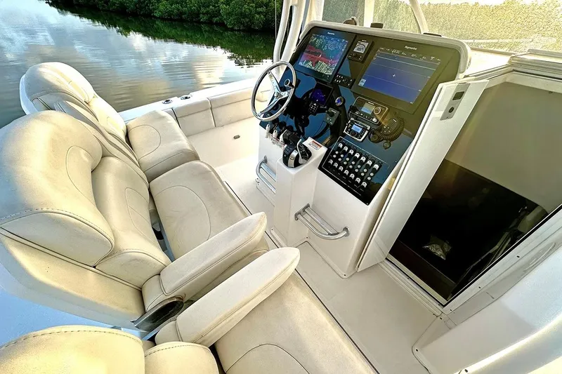  Yacht Photos Pics Interior of 2017 Stamas 390 Tarpon boat with modern dashboard and comfortable seating.