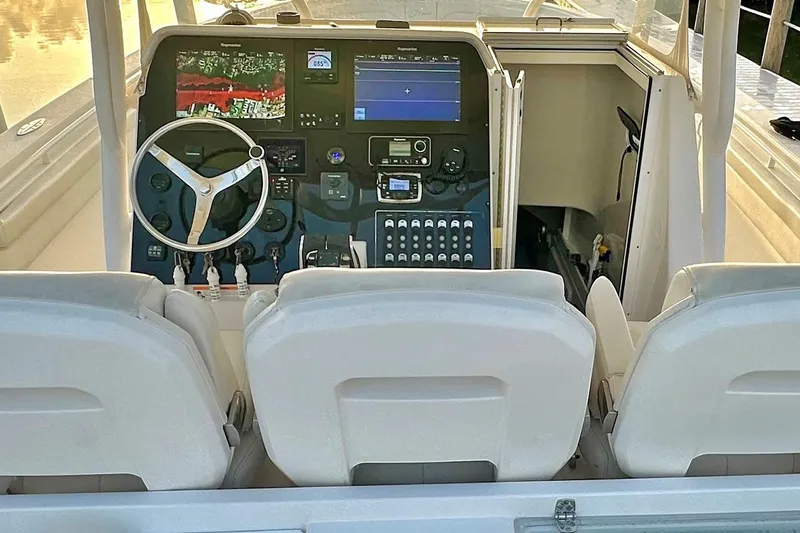  Yacht Photos Pics 2017 Stamas 390 Tarpon boat cockpit with steering wheel and navigation controls.