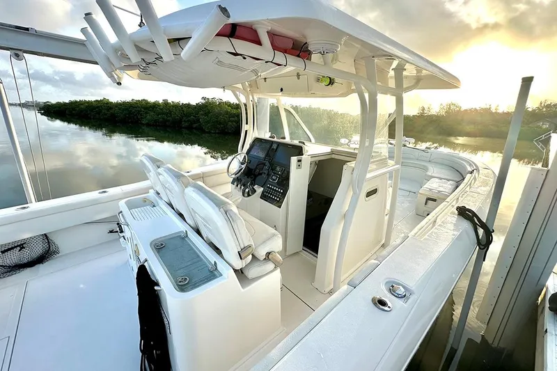  Yacht Photos Pics 2017 Stamas 390 Tarpon boat interior with helm, seats, and serene water backdrop.