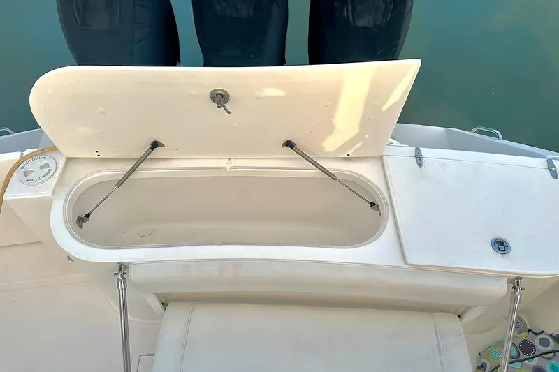  Yacht Photos Pics Open storage compartment on 2017 Stamas 390 Tarpon boat, showing interior details.