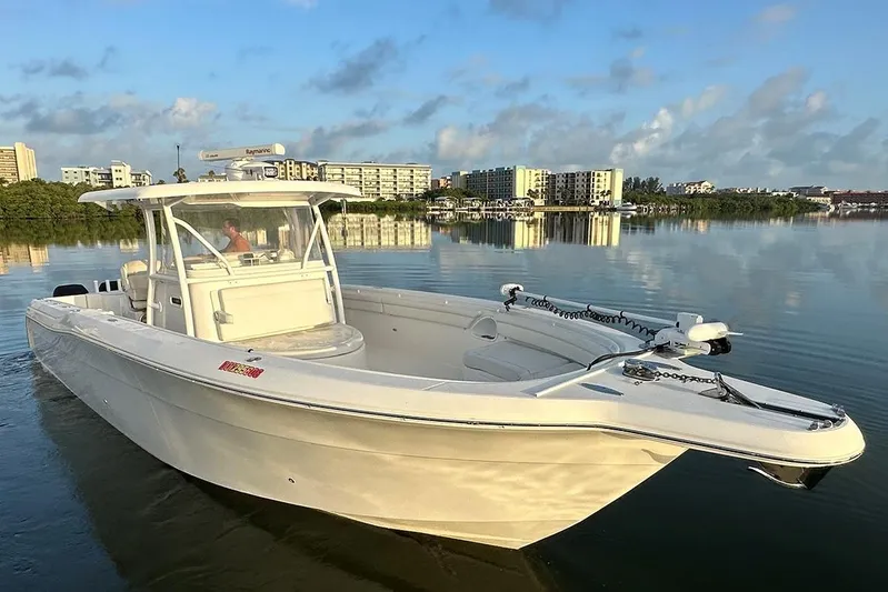  Yacht Photos Pics 2017 Stamas 390 Tarpon boat on calm water with cityscape background.