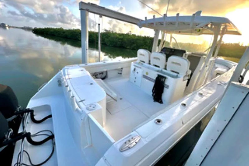  Yacht Photos Pics 2017 Stamas 390 Tarpon boat at sunrise, featuring spacious deck and seating.