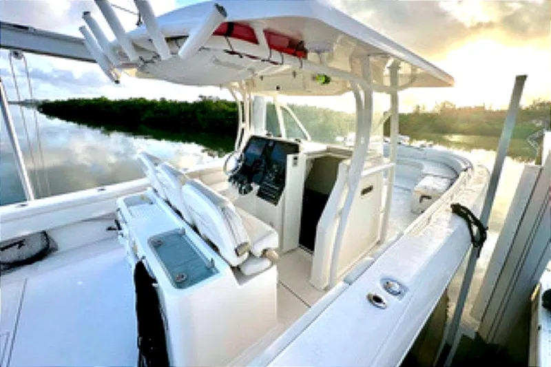 Yacht Photos Pics 2017 Stamas 390 Tarpon boat interior at sunrise, docked on calm water.