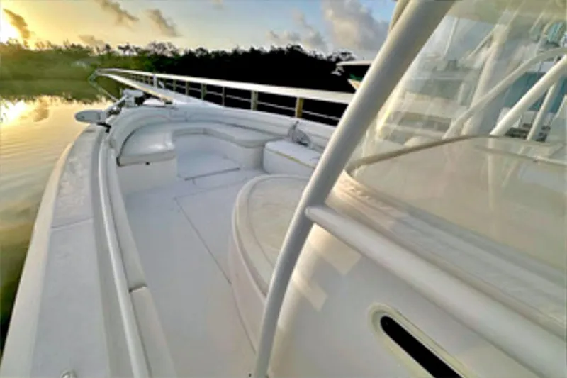  Yacht Photos Pics 2017 Stamas 390 Tarpon boat at sunrise, featuring sleek white deck and railing.