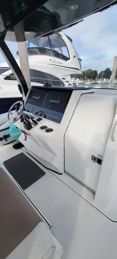  Yacht Photos Pics 2018 Edgewater 370CC boat cockpit with modern navigation system and sleek design.