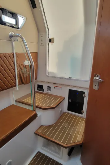  Yacht Photos Pics Interior of 2018 Edgewater 370CC boat with wooden steps and modern design.
