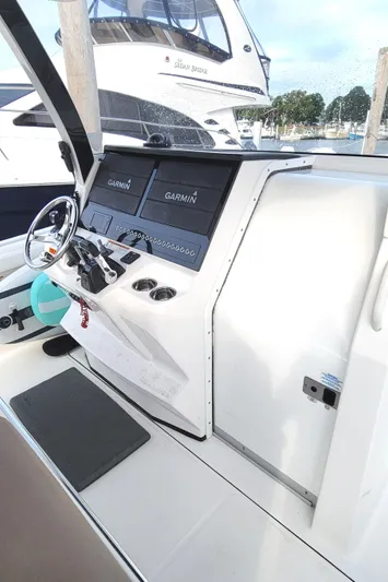  Yacht Photos Pics 2018 Edgewater 370CC boat cockpit with Garmin navigation system.