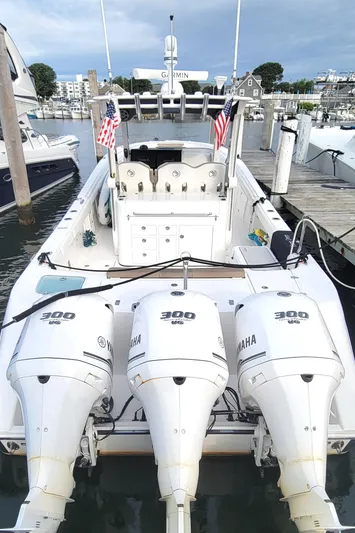 Yacht Photos Pics 2018 Edgewater 370CC boat with triple Yamaha 300 engines docked at marina.