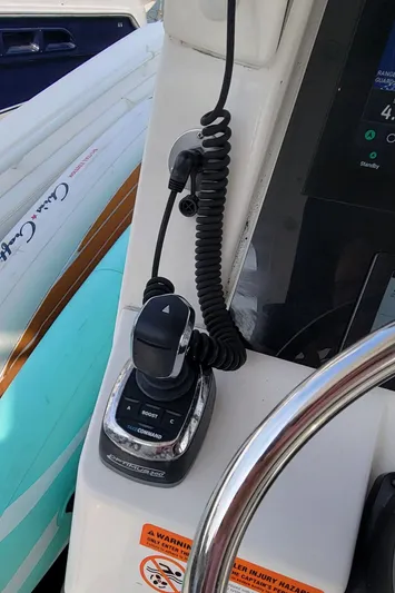 Yacht Photos Pics 2018 Edgewater 370CC boat control panel with steering wheel and throttle.