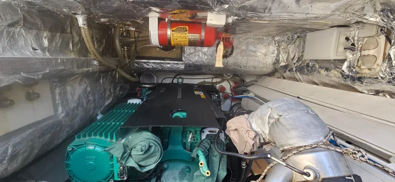  Yacht Photos Pics Engine room of 2019 Sunreef 40 Power yacht with visible machinery and fire extinguisher.