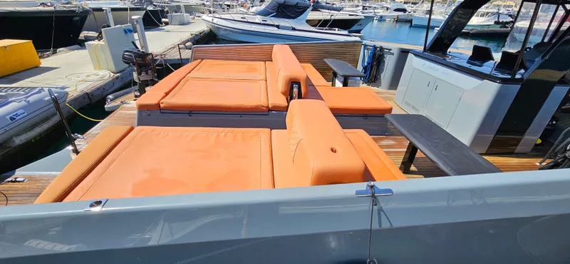  Yacht Photos Pics 2019 Sunreef 40 Power yacht with orange deck seating, docked at a marina.