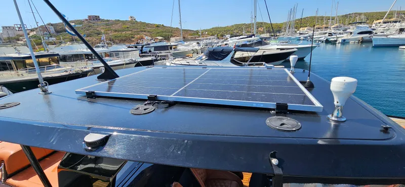  Yacht Photos Pics Sunreef 40 Power 2019 yacht with solar panel, docked in a marina.
