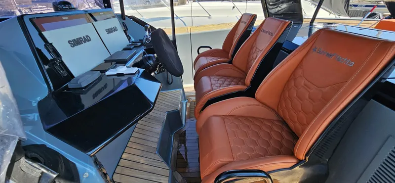  Yacht Photos Pics Luxurious interior of 2019 Sunreef 40 Power yacht with leather seating and modern controls.