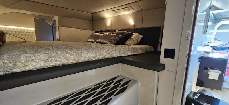  Yacht Photos Pics Luxurious interior cabin of 2019 Sunreef 40 Power yacht with elegant bedding.