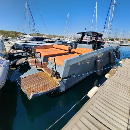  Yacht Photos Pics 2019 Sunreef 40 Power yacht docked, featuring orange seating and sleek design.