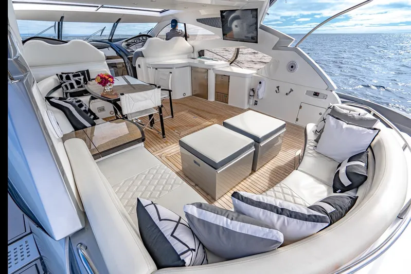  Yacht Photos Pics Luxurious Sunseeker Predator 68 yacht interior, 2021 model, featuring elegant seating and ocean view.