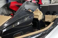 2022 Zar Formenti 85 SL luxury boat interior with beige seating and sleek black design.