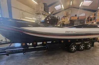 2022 Zar Formenti 85 SL boat on trailer in indoor storage facility.