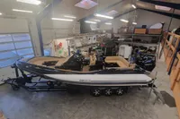 2022 Zar Formenti 85 SL boat in a spacious garage, showcasing sleek design and modern features.