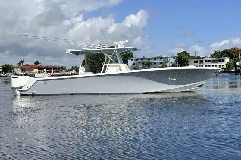 Bluefin Yacht Photos Pics 2017 SeaVee 370Z boat on calm water under a partly cloudy sky.