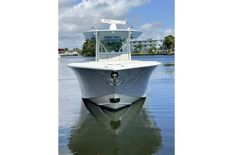 Bluefin Yacht Photos Pics 2017 SeaVee 370Z boat on calm water, front view, clear sky background.