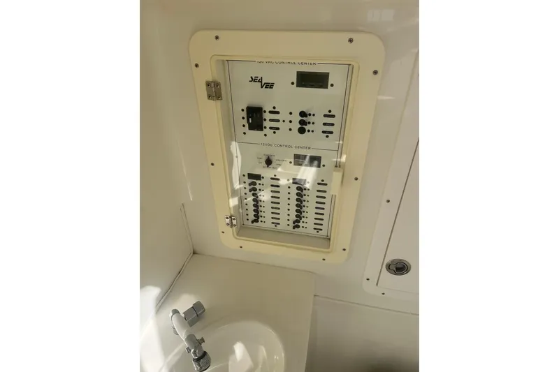 Bluefin Yacht Photos Pics Electrical control panel on a 2017 SeaVee 370Z boat, near a sink.