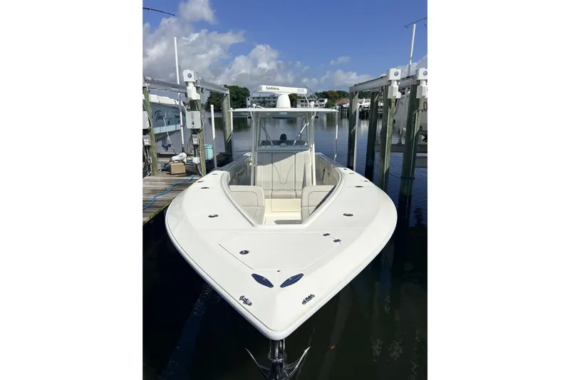 Bluefin Yacht Photos Pics 2017 SeaVee 370Z boat docked, featuring sleek design and spacious deck.