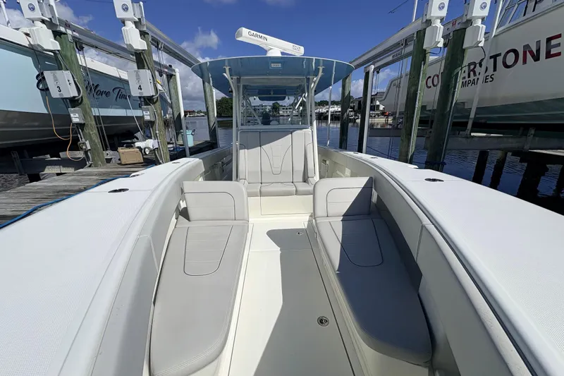 Bluefin Yacht Photos Pics 2017 SeaVee 370Z boat interior with seating, docked at marina.