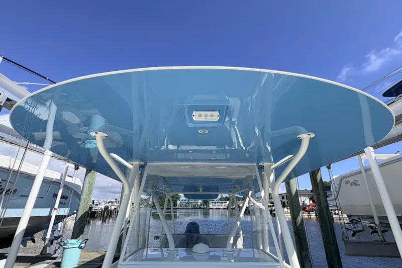Bluefin Yacht Photos Pics 2017 SeaVee 370Z boat with blue T-top at marina dock.