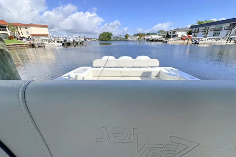 Bluefin Yacht Photos Pics 2017 SeaVee 370Z boat docked in a scenic marina with clear skies.