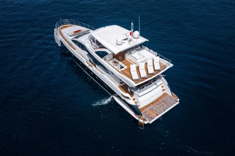  Yacht Photos Pics Luxurious 2014 Azimut 80 yacht cruising on open water, aerial view.