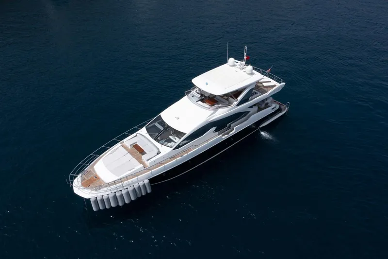  Yacht Photos Pics Azimut 80 yacht, 2014 model, cruising on calm blue waters, aerial view.
