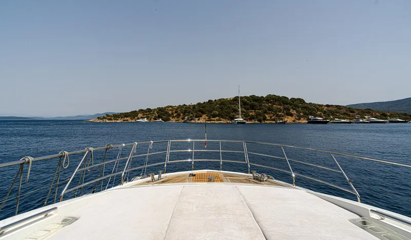  Yacht Photos Pics Azimut 80 yacht cruising towards a scenic island, clear blue waters, sunny day, 2014 model.