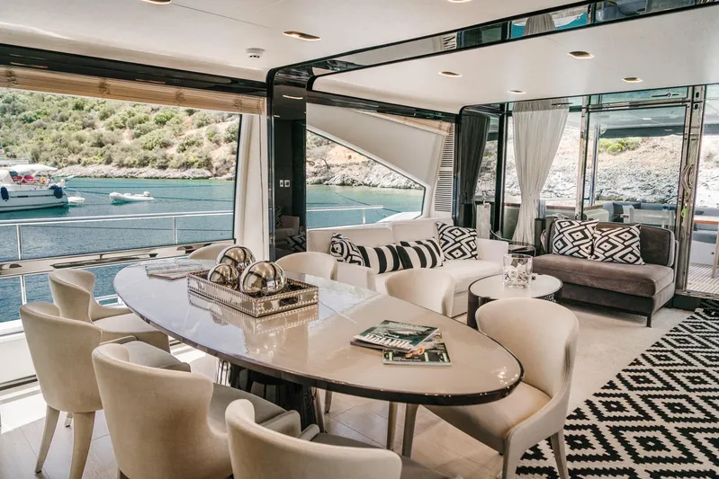  Yacht Photos Pics Luxurious interior of 2014 Azimut 80 yacht with elegant dining area and scenic ocean view.