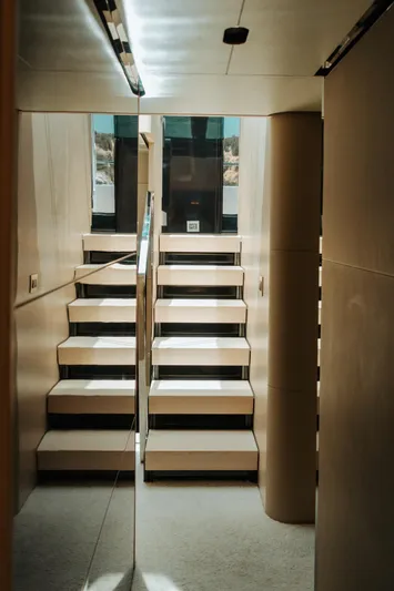  Yacht Photos Pics Interior staircase of 2014 Azimut 80 yacht, featuring modern design and sleek finishes.