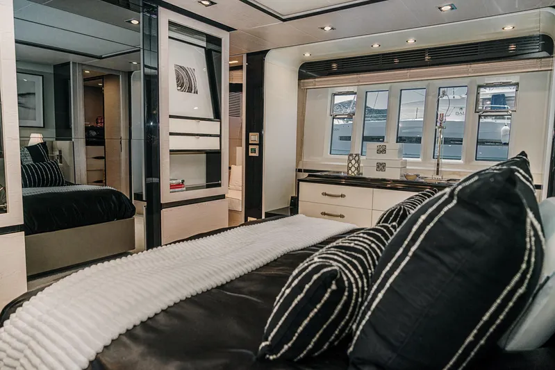  Yacht Photos Pics Luxurious bedroom interior of 2014 Azimut 80 yacht with modern decor and striped pillows.