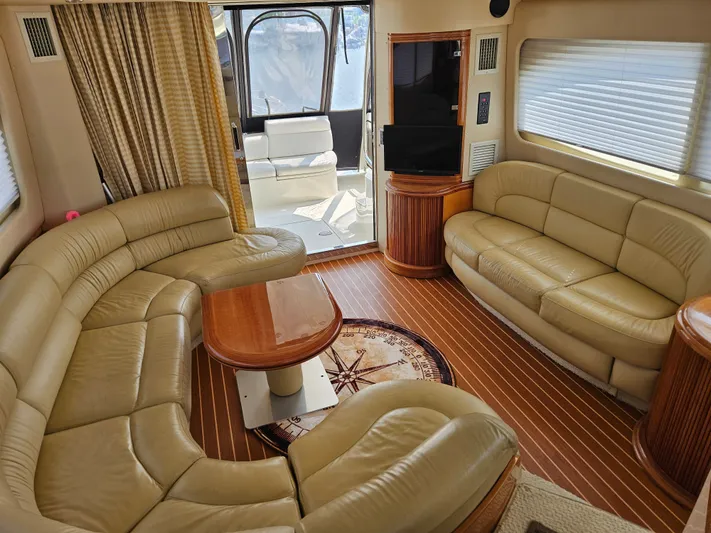 Bella Vita Yacht Photos Pics Luxurious interior of a 2003 Azimut 46 MY yacht with leather seating and wood accents.