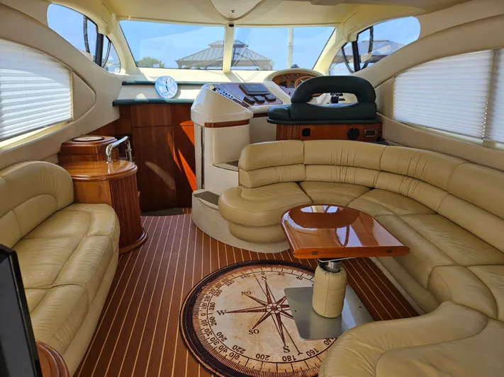 Bella Vita Yacht Photos Pics Luxurious interior of 2003 Azimut 46 MY yacht with leather seating and wooden accents.