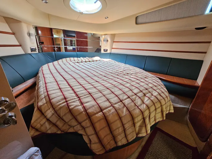 Bella Vita Yacht Photos Pics Luxurious bedroom interior of 2003 Azimut 46 MY yacht with circular bed and skylight.