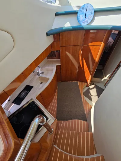 Bella Vita Yacht Photos Pics Interior of 2003 Azimut 46 MY yacht with wooden cabinetry and modern kitchen amenities.