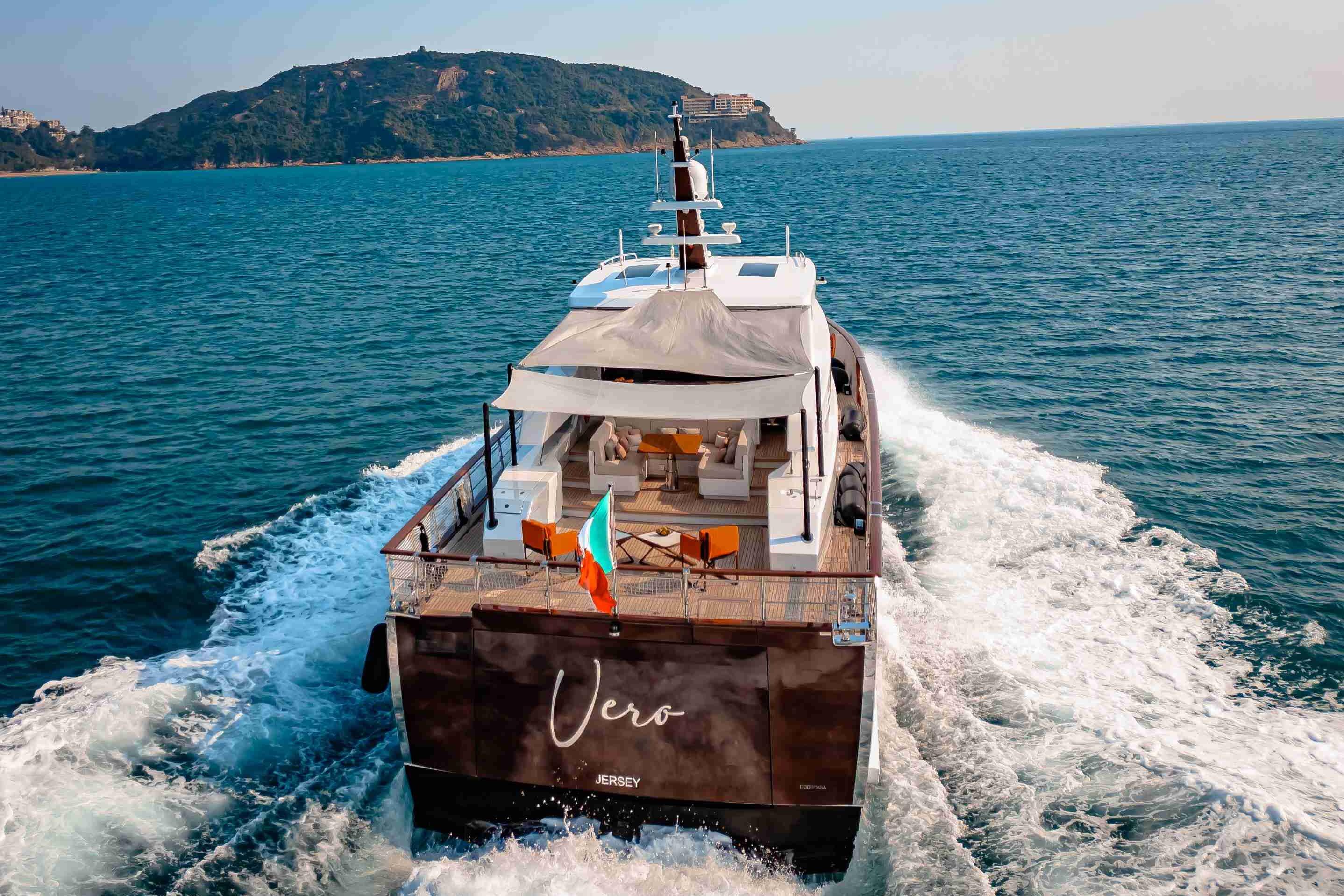 Luxurious 2024 Codecasa F242 yacht cruising on open sea near scenic coastline.