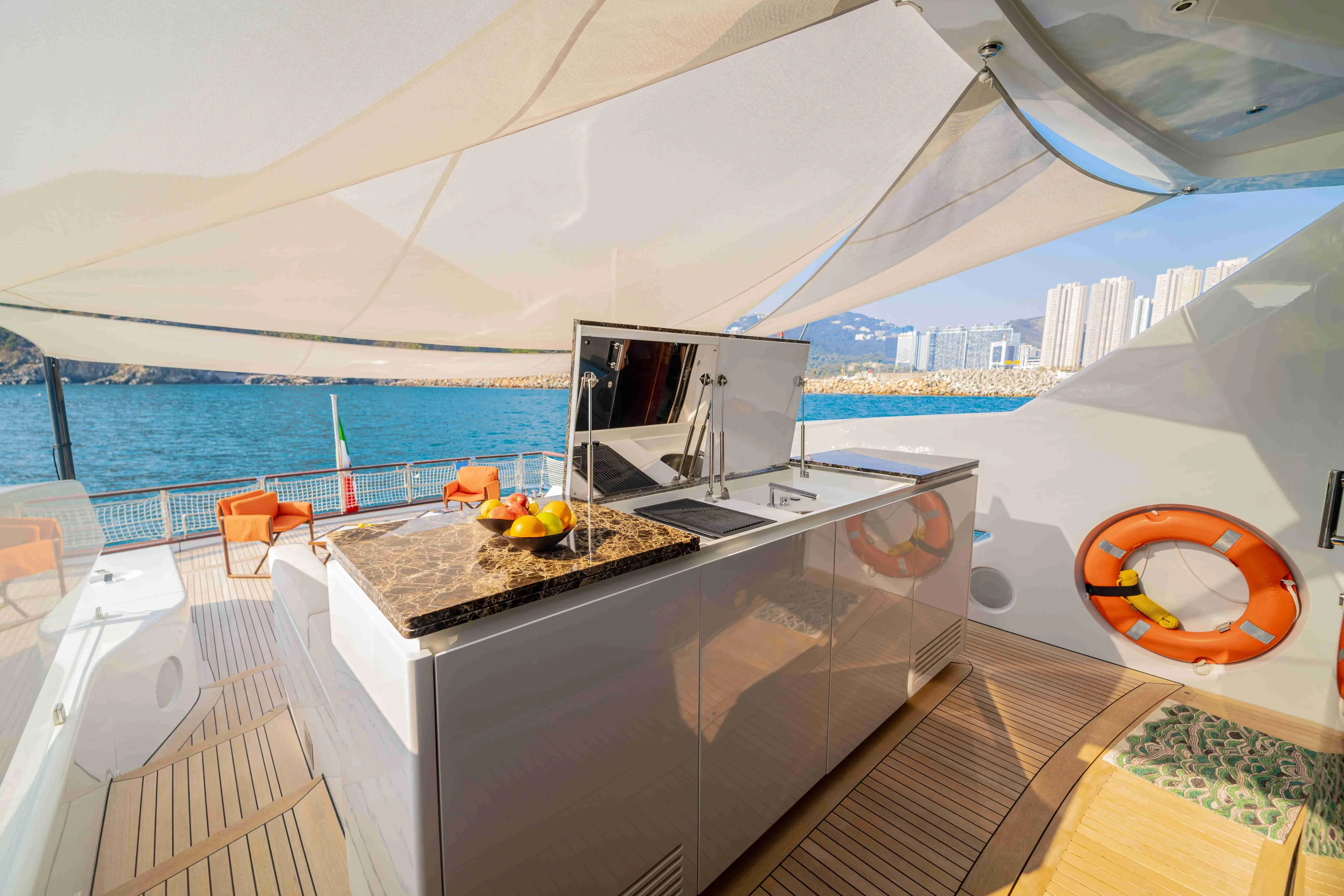 Luxurious 2024 Codecasa F242 yacht deck with modern kitchen and ocean view.