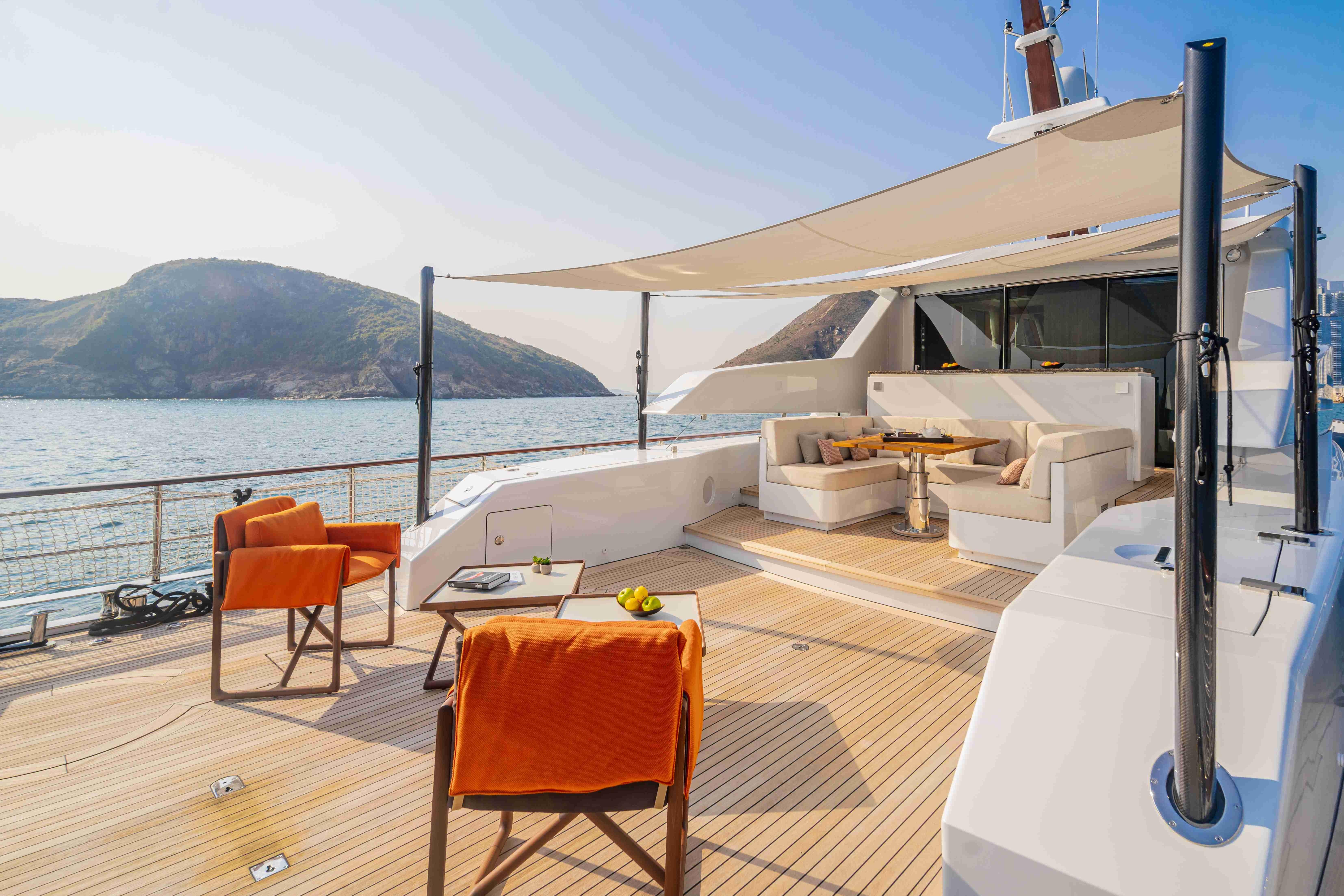 Luxurious 2024 Codecasa F242 yacht deck with elegant seating and ocean view.