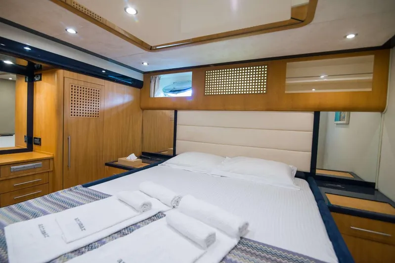  Yacht Photos Pics Luxurious cabin interior of 2000 Riva 70 Dolcevita yacht with modern wood finishes.