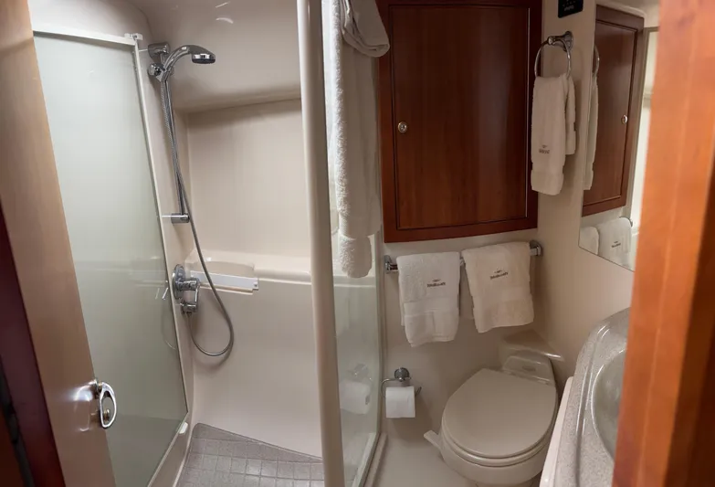  Yacht Photos Pics Bathroom interior of a 2004 Riviera 4000 yacht with shower and toilet.