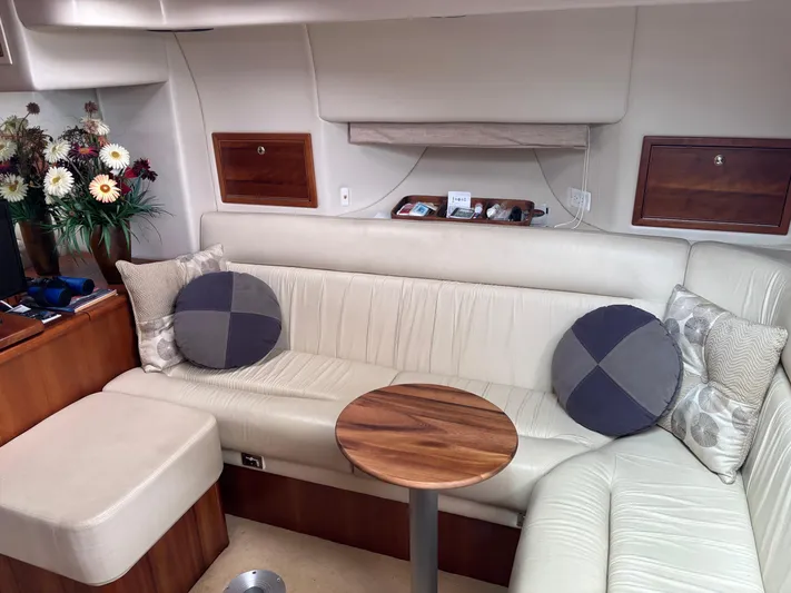  Yacht Photos Pics Luxurious interior of 2004 Riviera 4000 yacht with plush seating and elegant decor.